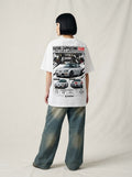 Model wearing white Suzuki Cappuccino EA11R graphic T-shirt, back view